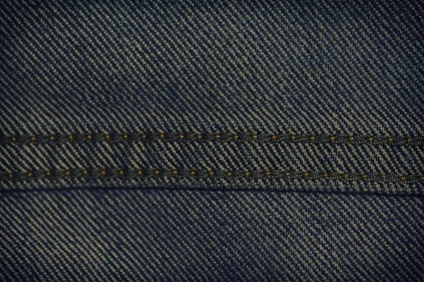 Textura de ganga com costura bege para fundo de jeans — Fotografia de Stock