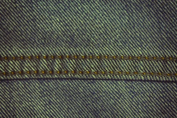 Denim textuur met beige naad voor jeans achtergrond — Stockfoto