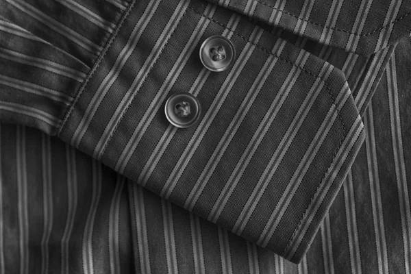Part of striped shirt with buttons, monochrome texture or background