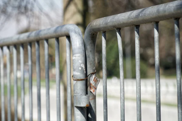 Fence in public park, safety access in entrance — Stock Photo, Image
