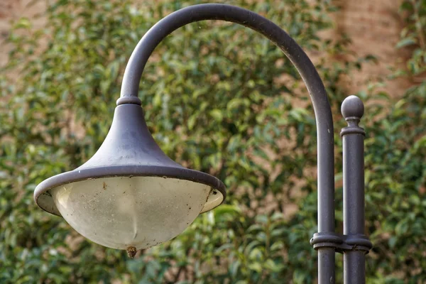 Street lantern in sunny day, turned off, urban background