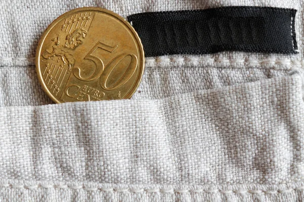 欧元硬币与一个面额的五十欧元美分的口袋里的亚麻裤与黑色条纹 — 图库照片