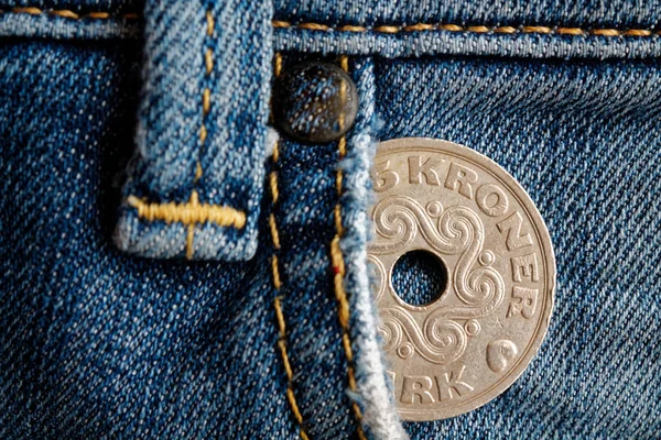 Denmark coin denomination is 5 krone (crown) in the pocket of old worn denim jeans