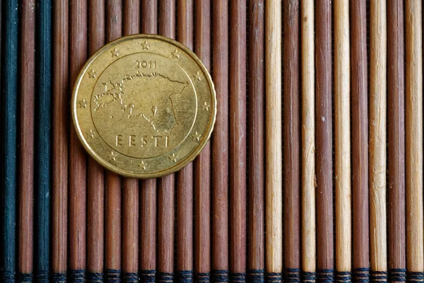 Euro coin denomination is 50 euro cents lie on wooden bamboo table - back side — Stock Photo, Image