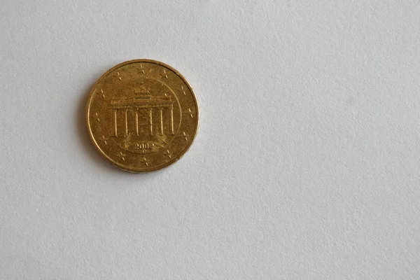 One euro coin lie on isolated white background Denomination is 10 euro cent - back side — Stock Photo, Image