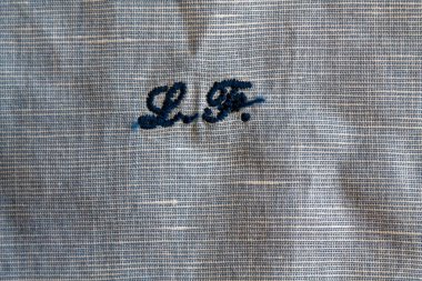 Mavi keten yakın çekim doku veya arka plan baş harfleri ile