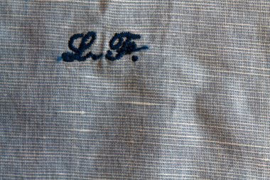 Mavi keten yakın çekim doku veya arka plan baş harfleri ile