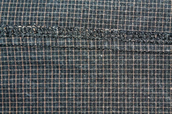 Grungy Denim in einem Quadrat. Vintage dunkelgraue Jeans, gut für Hintergrund — Stockfoto