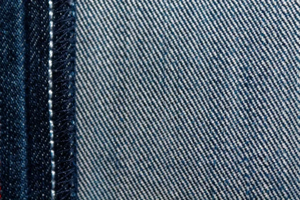 Textura de ganga com costura branca para fundo de jeans — Fotografia de Stock