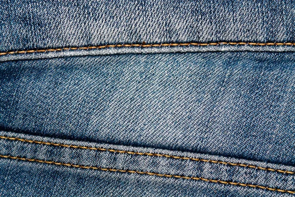 Närbild av föråldrade blå jeans skosnören Denim konsistens, makro bakgrund för webbplats eller mobila enheter — Stockfoto