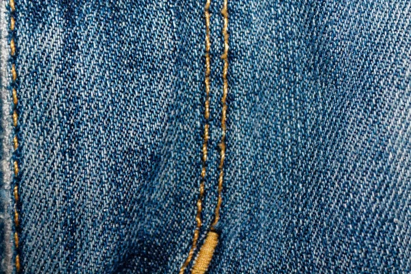 Närbild av blå jeans förkläde, Denim konsistens, makro bakgrund för webbplats eller mobila enheter — Stockfoto