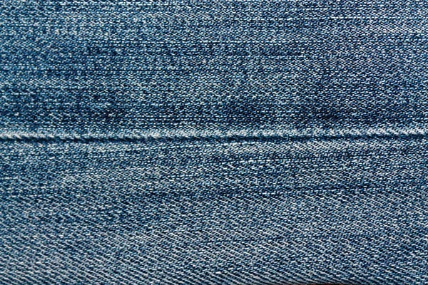 Blue Denim Makro Textur mit Naht für Jeans Hintergrund — Stockfoto