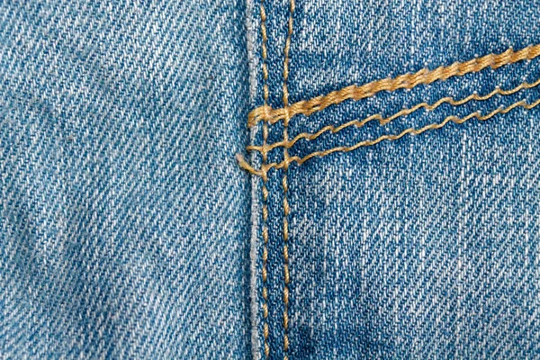Yakın çekim mavi kot pantolon dikiş, Denim doku, makro arka plan web siteniz veya mobil cihazlar için — Stok fotoğraf