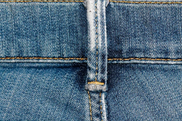 Närbild av föråldrade blå jeans skosnören Denim konsistens, makro bakgrund för webbplats eller mobila enheter — Stockfoto