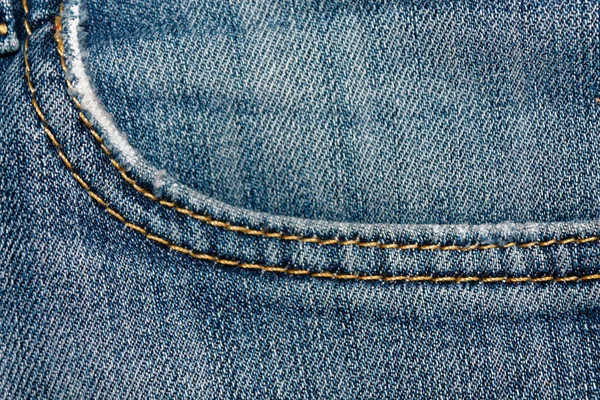 Närbild av föråldrade blå jeans ficka Denim konsistens, makro bakgrund för webbplats eller mobila enheter — Stockfoto