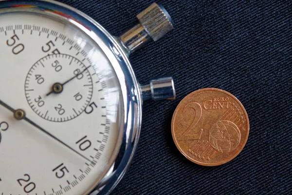 Euro para 2 euro cent ve kronometre siyah kot zemin - iş arka plan üzerinde bir mezhebi ile — Stok fotoğraf