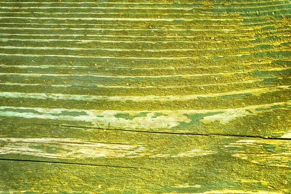 Ультра помаранчевий колір текстури старої, пухнастої, зеленої фарби на старій дерев'яній лавці — стокове фото