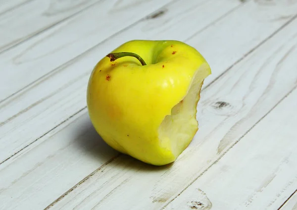Yellow Apple with the missing piece. A bit like the Apple logo.