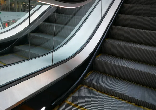 Modern escalator electronic system of movement in a shopping center