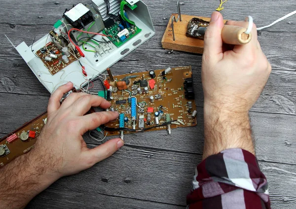 Master repairs electronic equipment