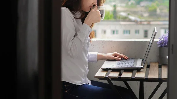 Banner bussinesswoman working and drinking coffee on balcony during quarantine. Remote education.