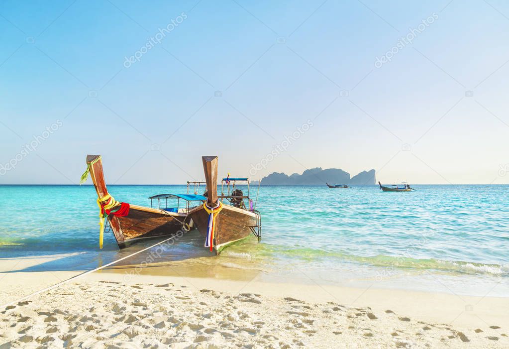 Two traditional thai longtail boats at famous sunset Long Beach,