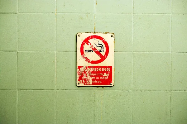 No smoking area sign on the wall