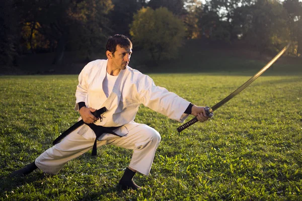 White ninja with sword — Stock Photo, Image