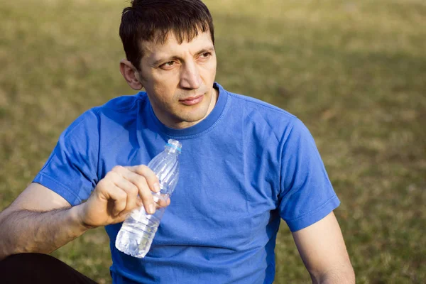 Man with bottle of water — Stock Photo, Image