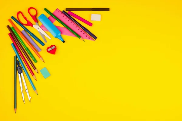 School supplies on yellow background — Stock Photo, Image