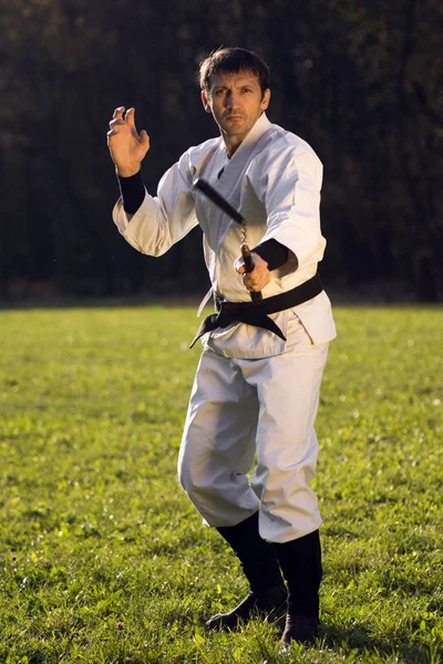 Practicing with nunchaku — Stock Photo, Image