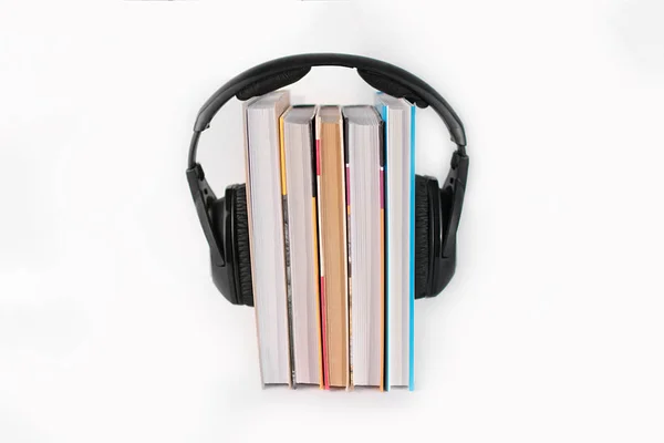 Five books on a white background vertically on top of them surro — Stock Photo, Image