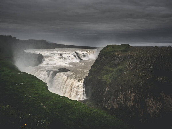 big majestic Gullfoss waterfall between rocks, Iceland