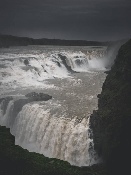 landscape with big majestic Gullfoss waterfall in mountains, Iceland