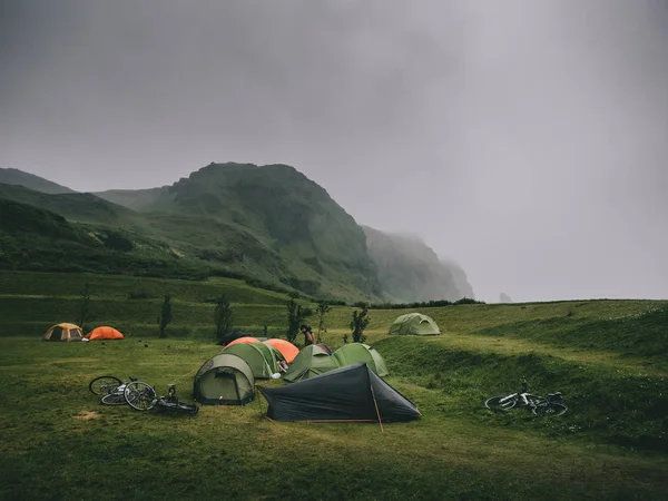 magnificent landscape with mountains and tents in camping, Iceland