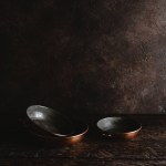 Close-up view of empty vintage utensils on rustic wooden table