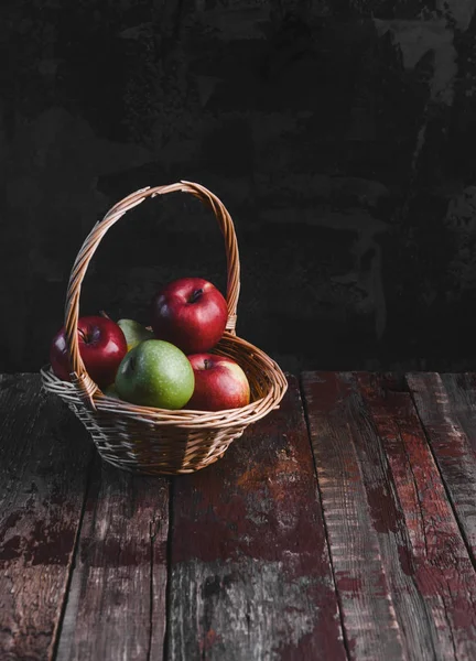 Wicker basket with apples — Stock Photo