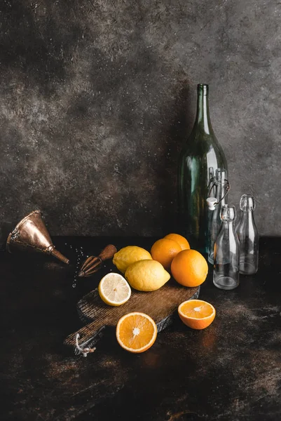 Bottles and citrus — Stock Photo