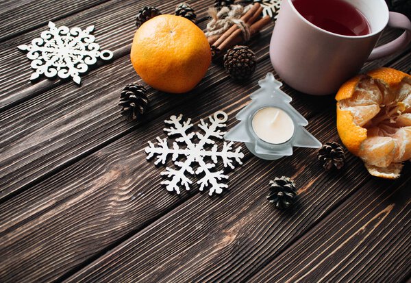 close-up of fresh orange with christmas decoration on wooden table