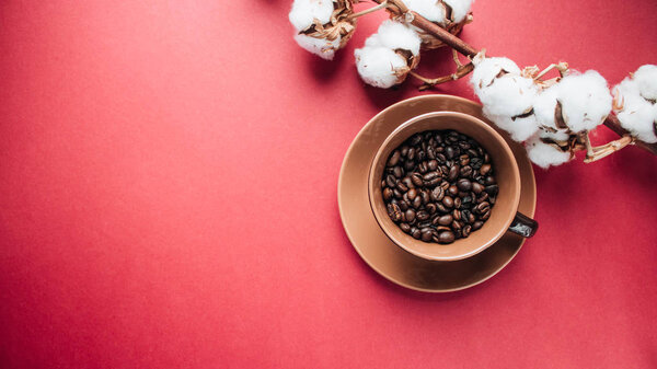 Cup of black coffee, coffee beans and cotton flowers on dark background — Stock Image Cup Black Coffee Coffee Beans Cotton Flowers Dark Background Royalty Free Stock Photos