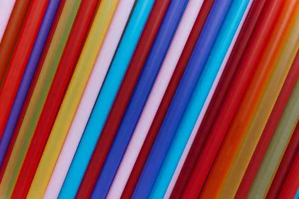 pile of colorful cocktail straws, creative texture