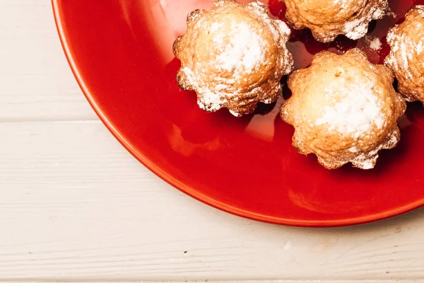 delicious sweet cupcakes on red plate, delicious homemade dessert