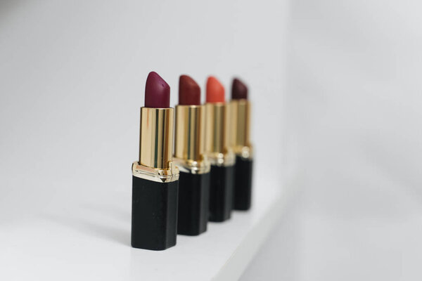 collection of lipsticks on white background