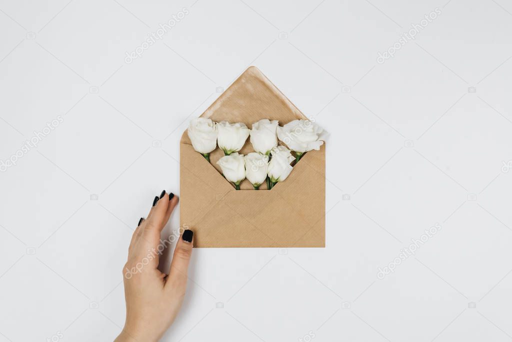 An envelope with flowers. Top view. Writing a letter. Message.8 march