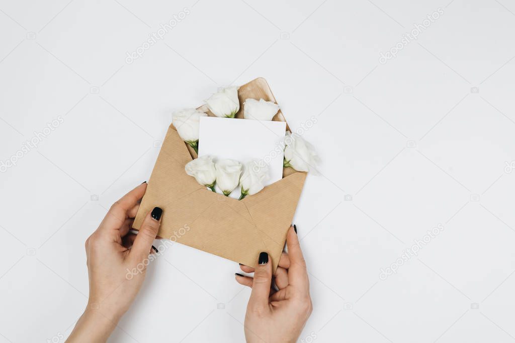 An envelope with flowers. Top view. Writing a letter. Message.8 march
