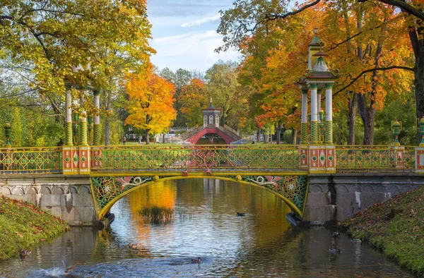 Chinese bridge in Alexander park in golden fall, Pushkin, Saint Petersburg, Russia