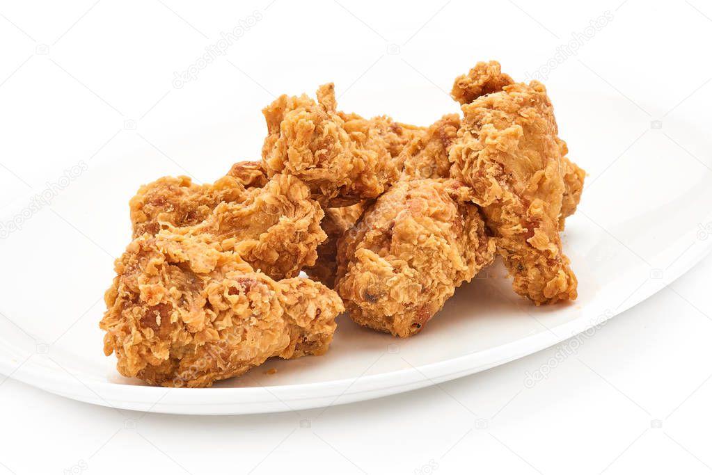 hot fried chicken wings on plate isolated on white background