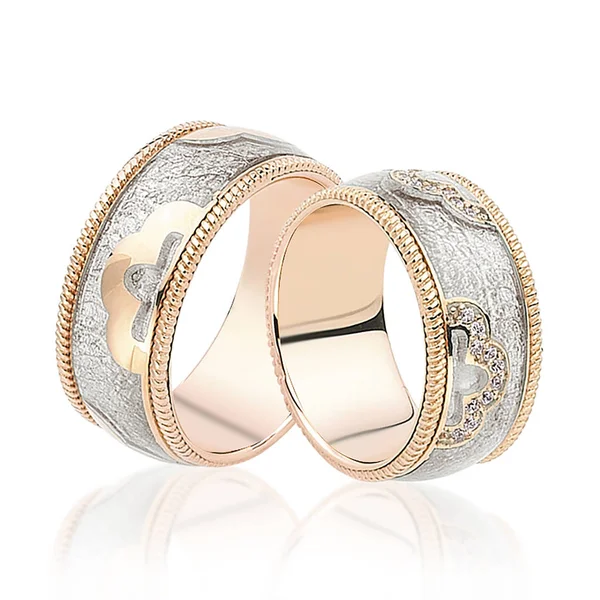 Couple of gold wedding rings on white background Stock Picture