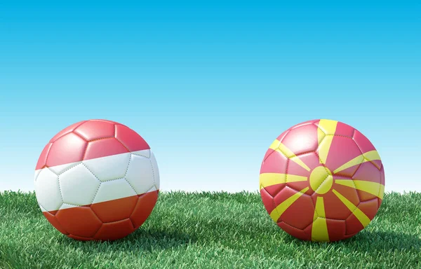 Two soccer balls in flags colors on green grass. Austria and North Macedonia. Group G. 3d image