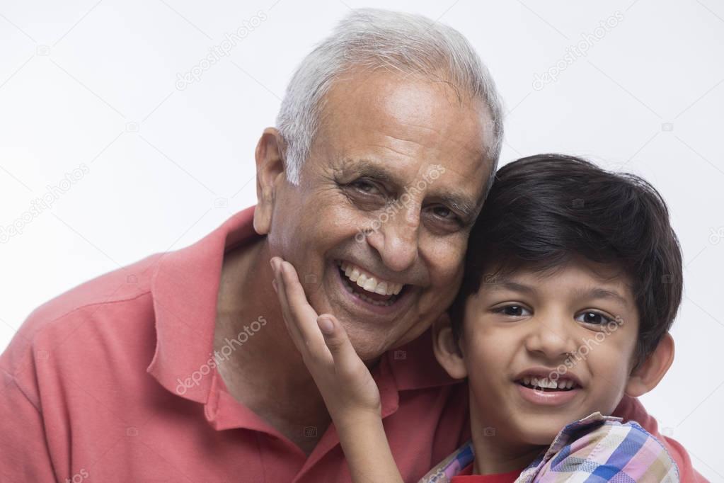 Portrait of smiling grandfather and grandson